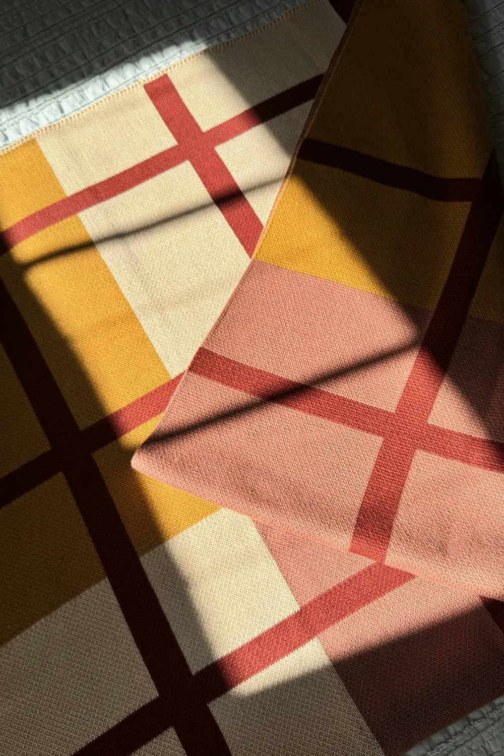 Rust, Camel, and Tan Plaid Organic Cotton Knit Blanket - Image 3