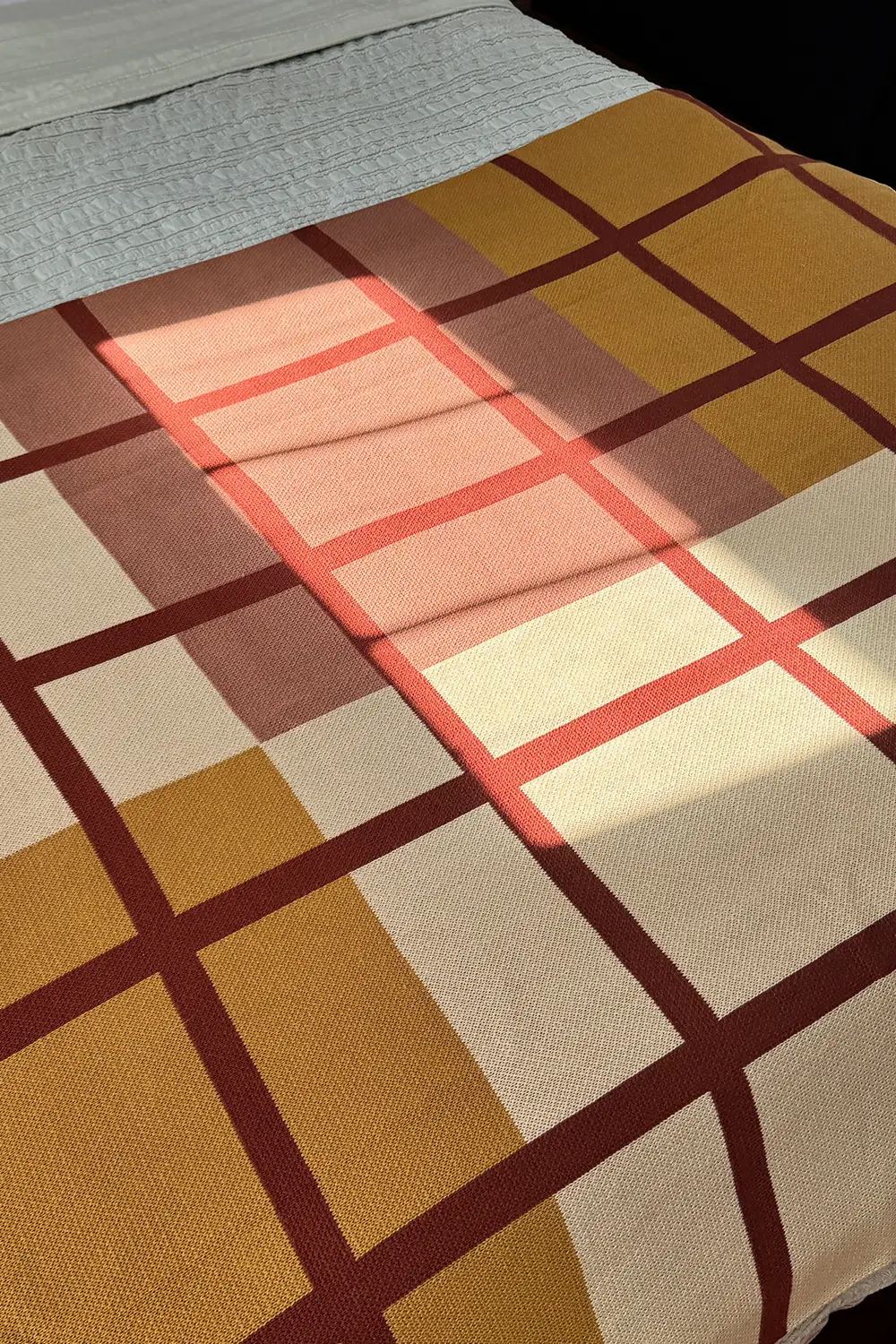Rust, Camel, and Tan Plaid Organic Cotton Knit Blanket - Image 4