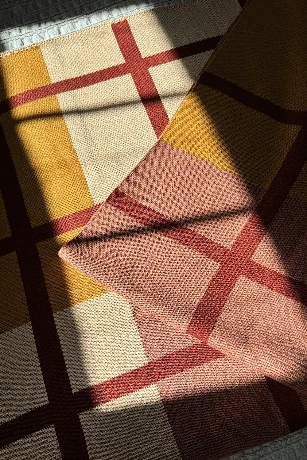 Rust, Camel, and Tan Plaid Organic Cotton Knit Blanket - Image 9
